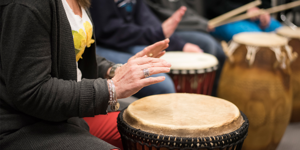 AACC students play percussion instruments in a classroom.