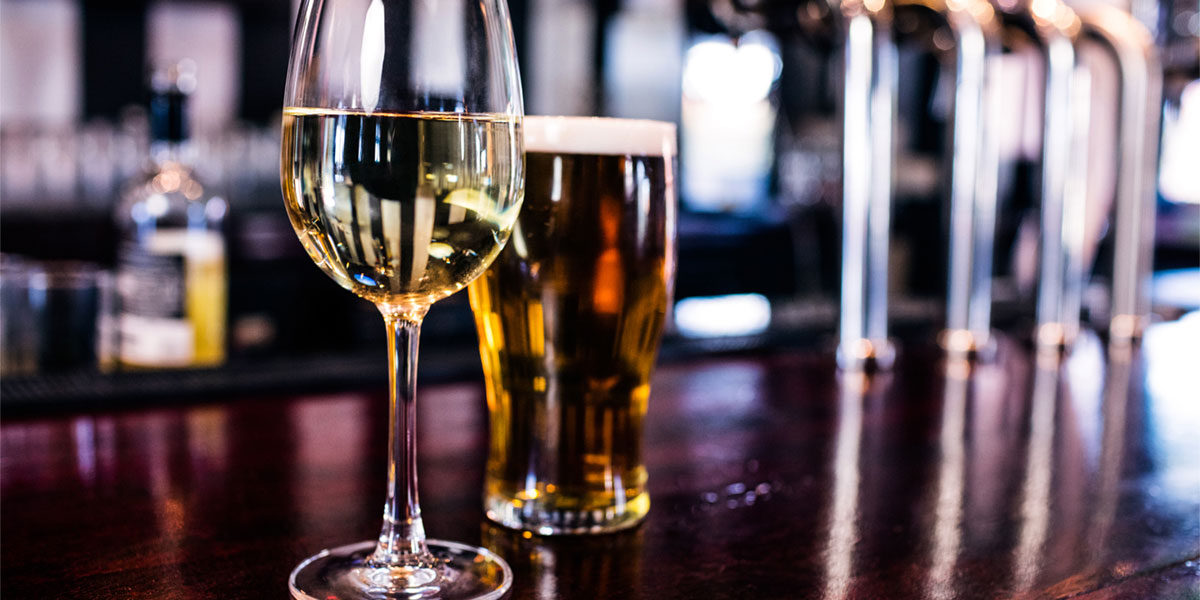 wine and beer glasses in restaurant setting