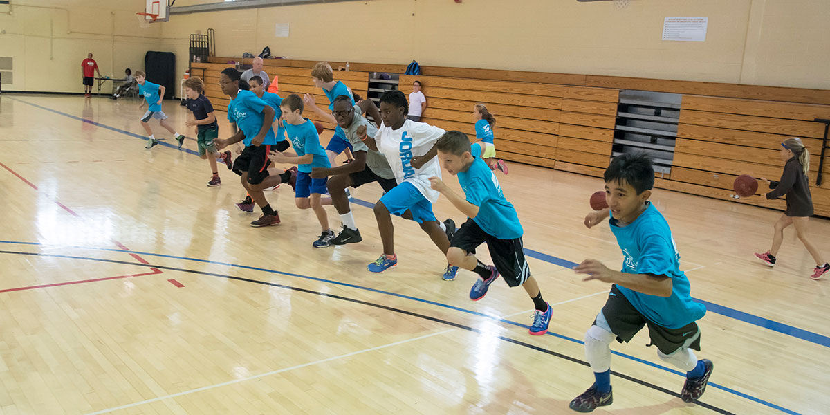 Image of kids running in the gym